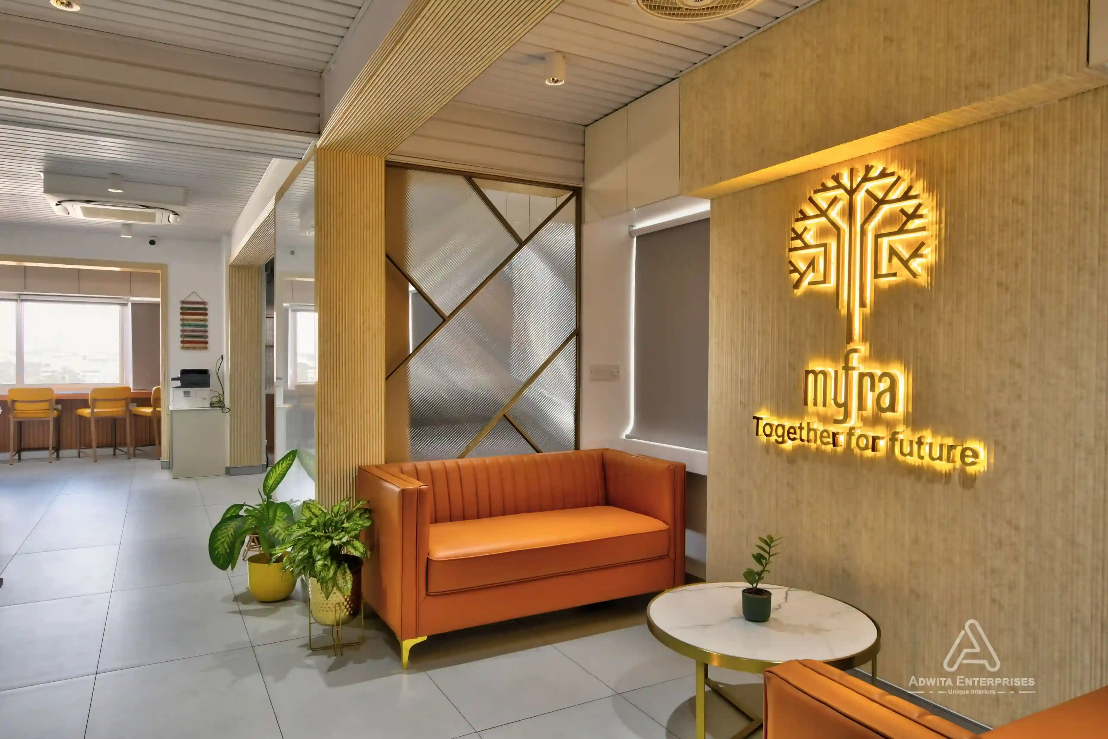 Waiting lounge featuring premium sofas and ambient lighting