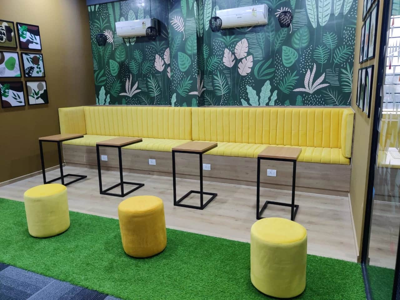 Discussion room with large conference table, ergonomic chairs, and modern lighting