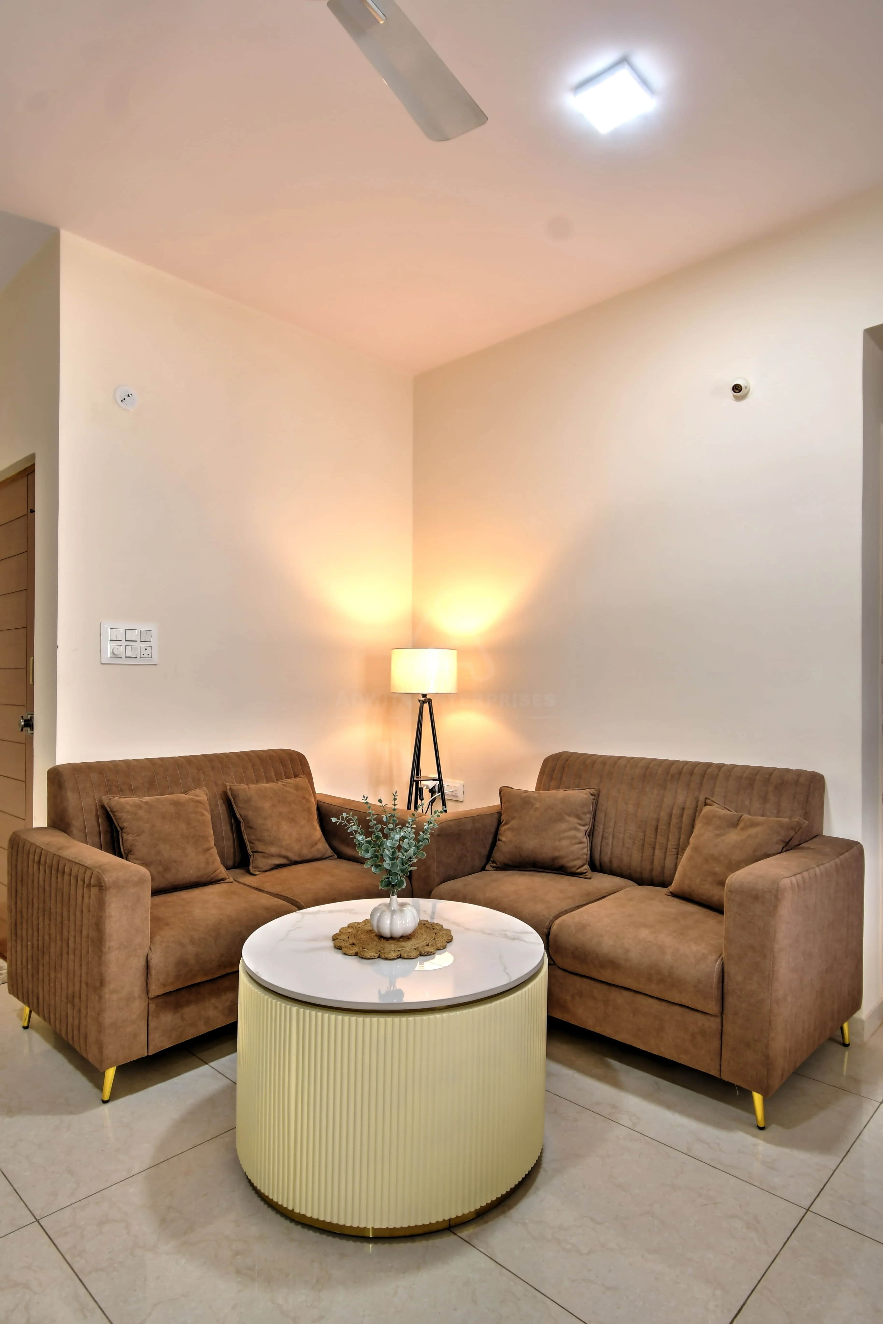 Modern living room featuring two single premium sofas and ambient lighting
