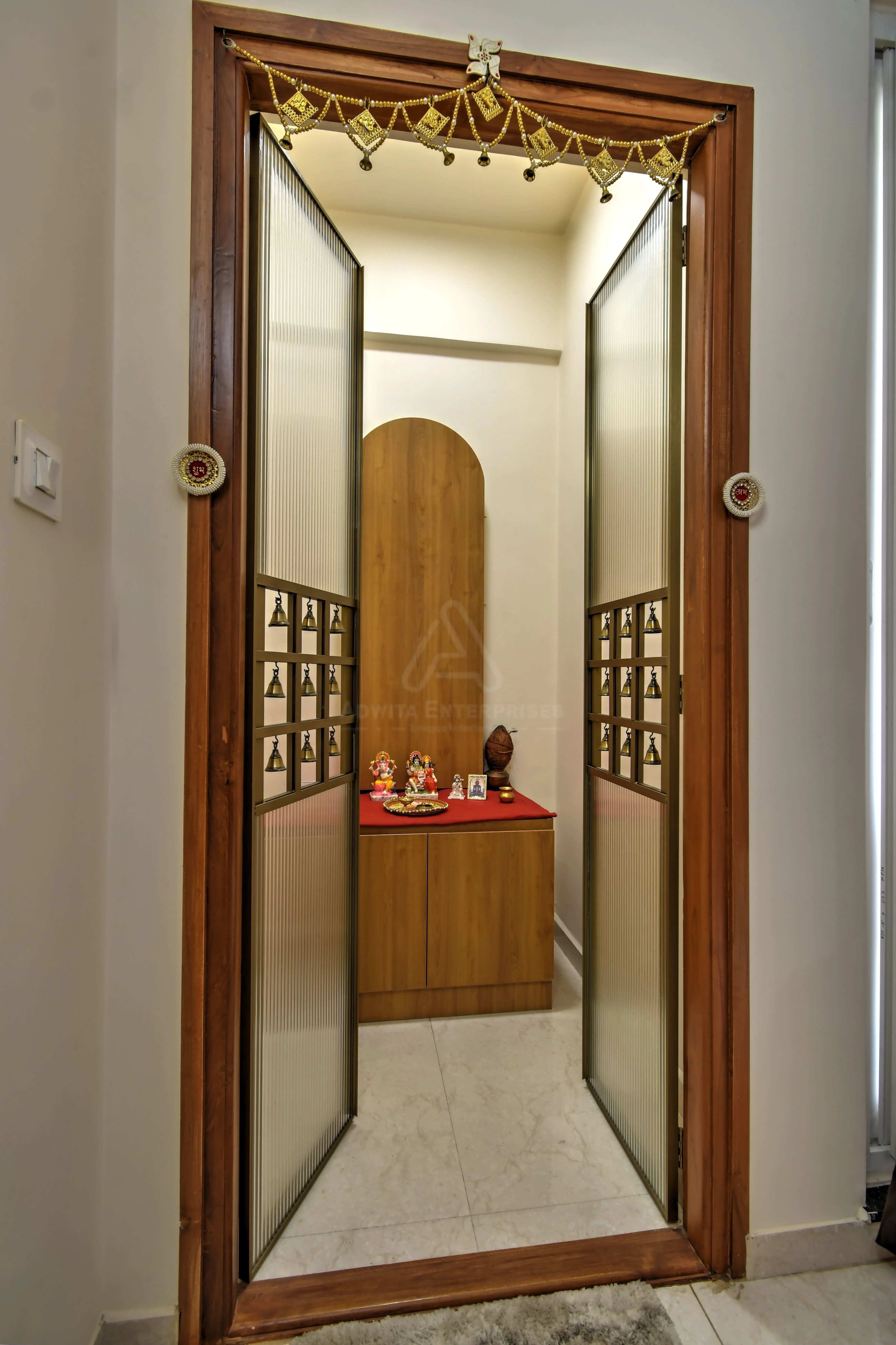 Beautifully crafted wooden Pooja unit with intricate design details